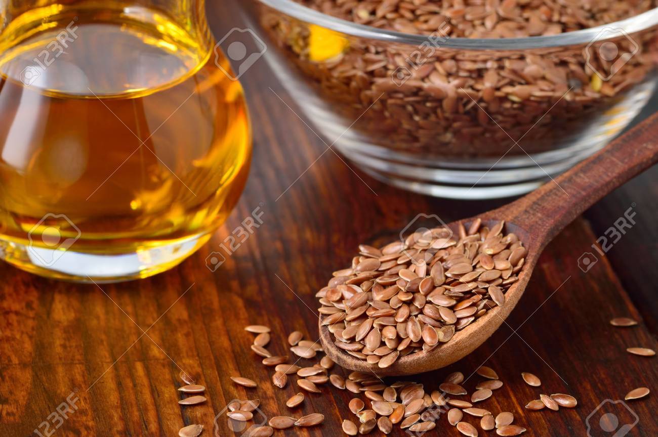 Brown Flax Seeds On Spoon And Flaxseed Oil In Glass Jug On Wooden Table Flax Oil Is Rich In Omega 3 Fatty Acid Stock Photo Picture And Royalty Free Image Image 34736706
