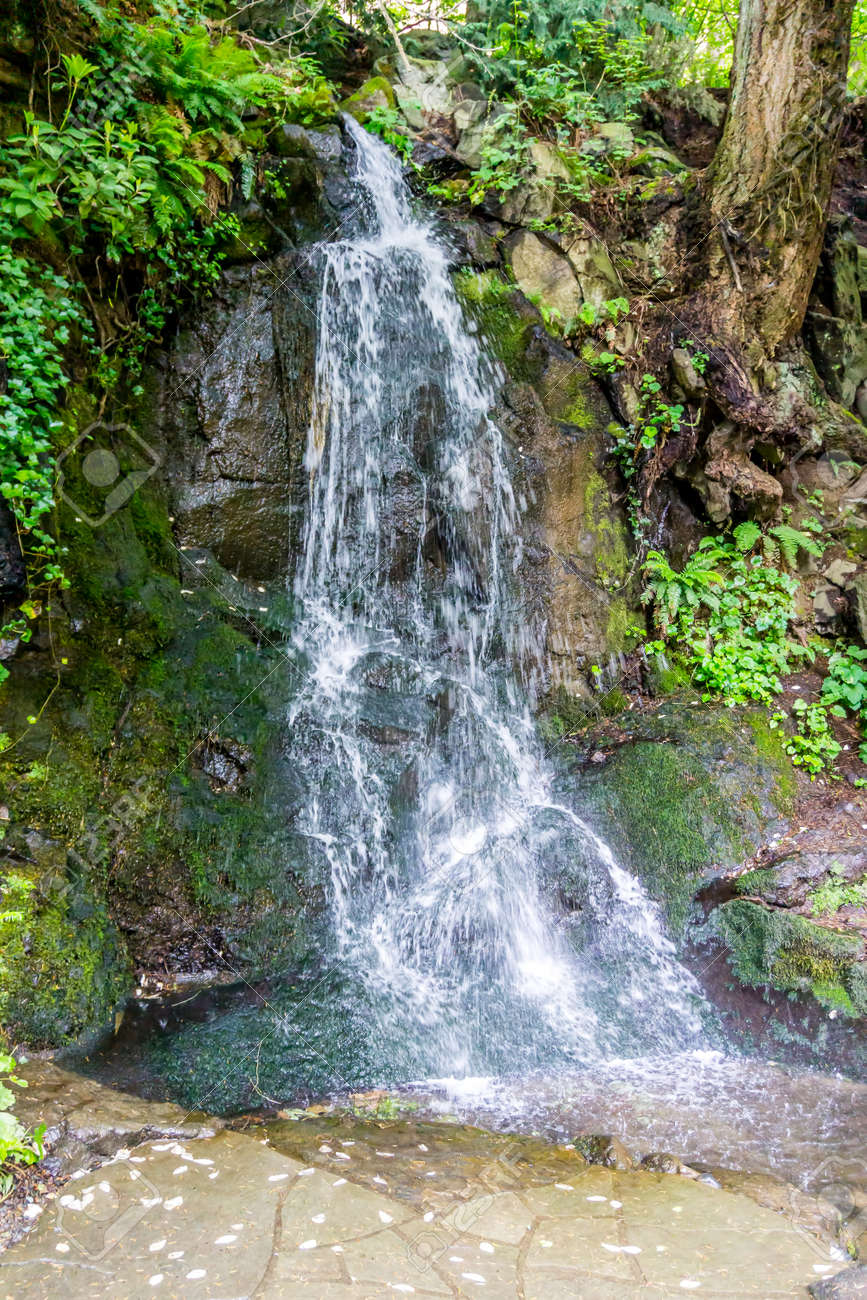 A waterfall flows among large rocks in Tumwater, Washington. - 171118502 A waterfall flows among large rocks in Tumwater, Washington. - 171118502