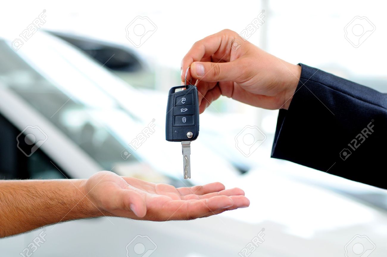 Handover Of Car Keys In A Dealership Stock Photo, Picture and Royalty Free  Image. Image 21129251.