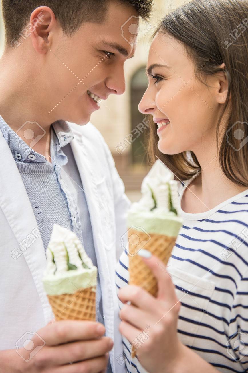 Young Beautiful Couple Walking In The Street And Enjoying Ice Cream Romantic Date Stock Photo Picture And Royalty Free Image Image 40642489