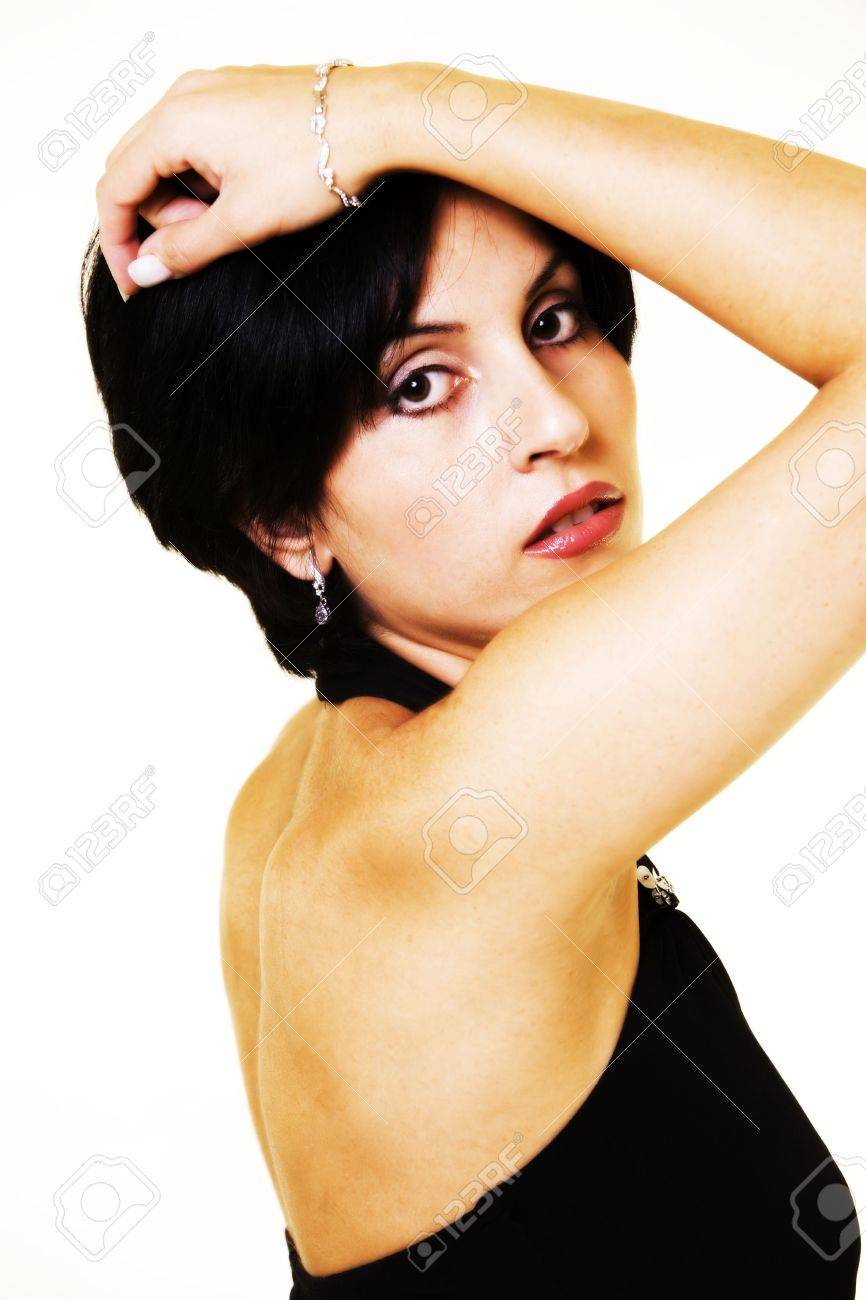 Close Up Of A Short Hair Brunette Woman Posing With Hand On Head