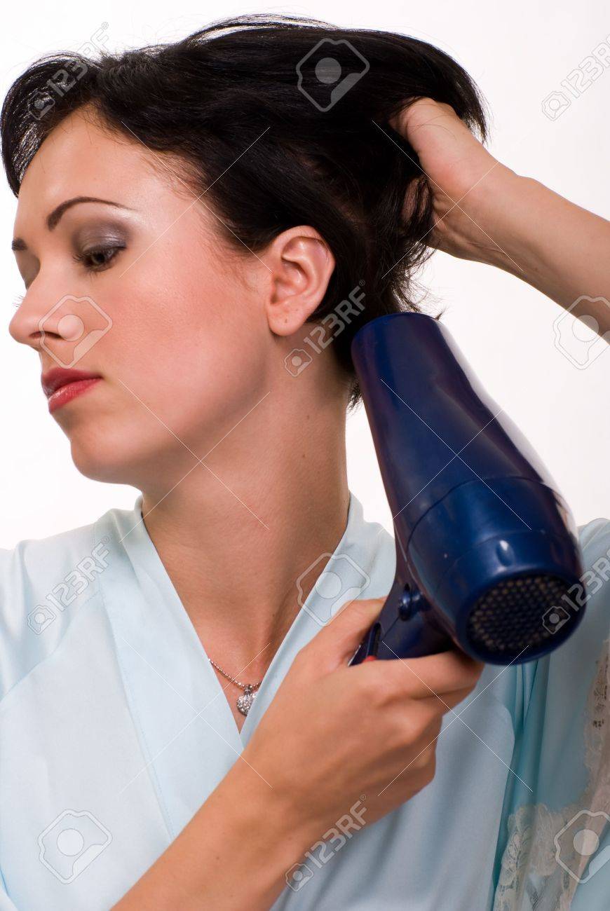 Attractive Short Hair Brunette Woman Up Close Holding A Blow