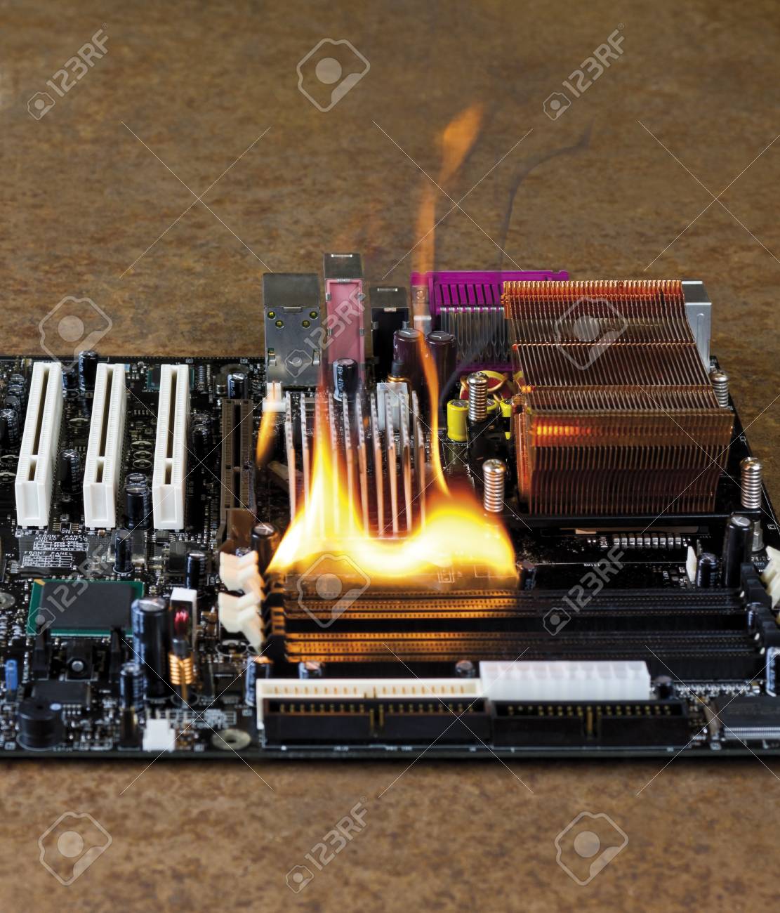 burning computer main board in rusty background stock photo picture burning computer
