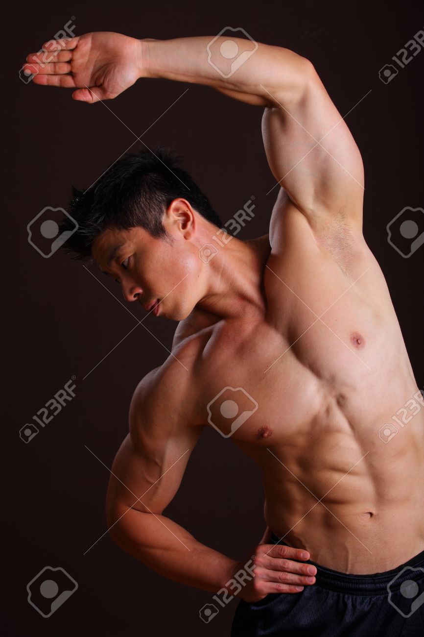 16940375-muscle-man-stretching-left-arm-and-abs-on-black-bacground.jpg