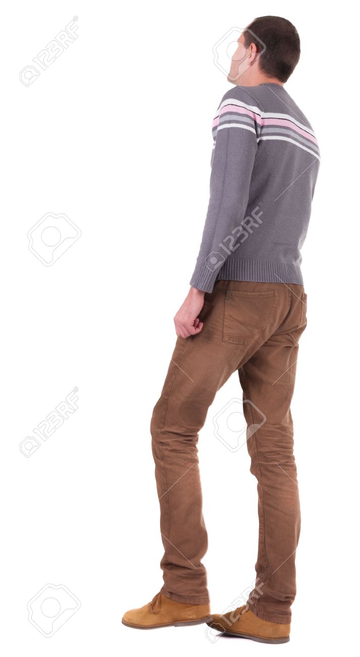 back view of going man in brown jeans and shoes walking stock