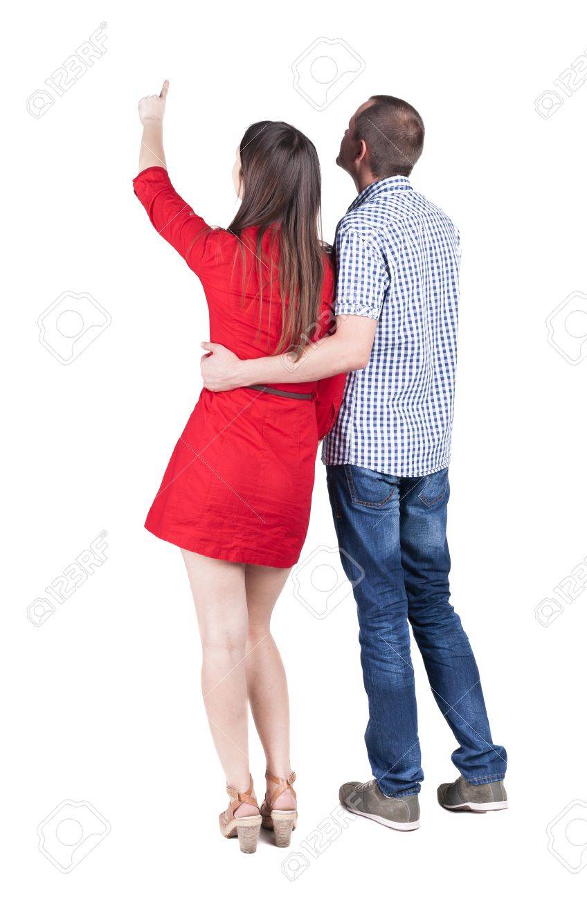 Jeune couple pointing at wal vue arrière (femme et homme Jeune couple pointing at wal vue arrière (femme et homme