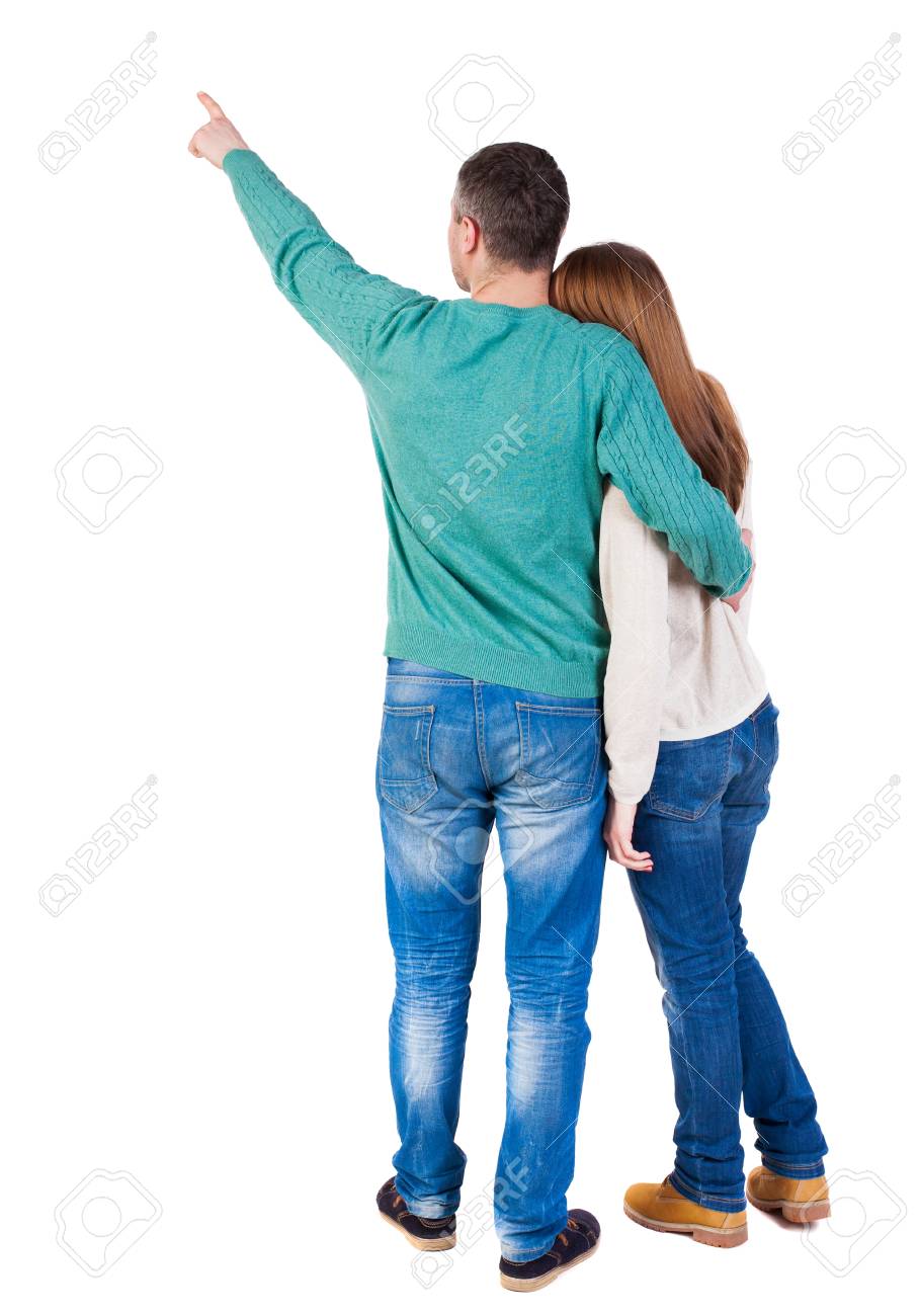 Jeune couple pointing at wal vue arrière (femme et homme Jeune couple pointing at wal vue arrière (femme et homme