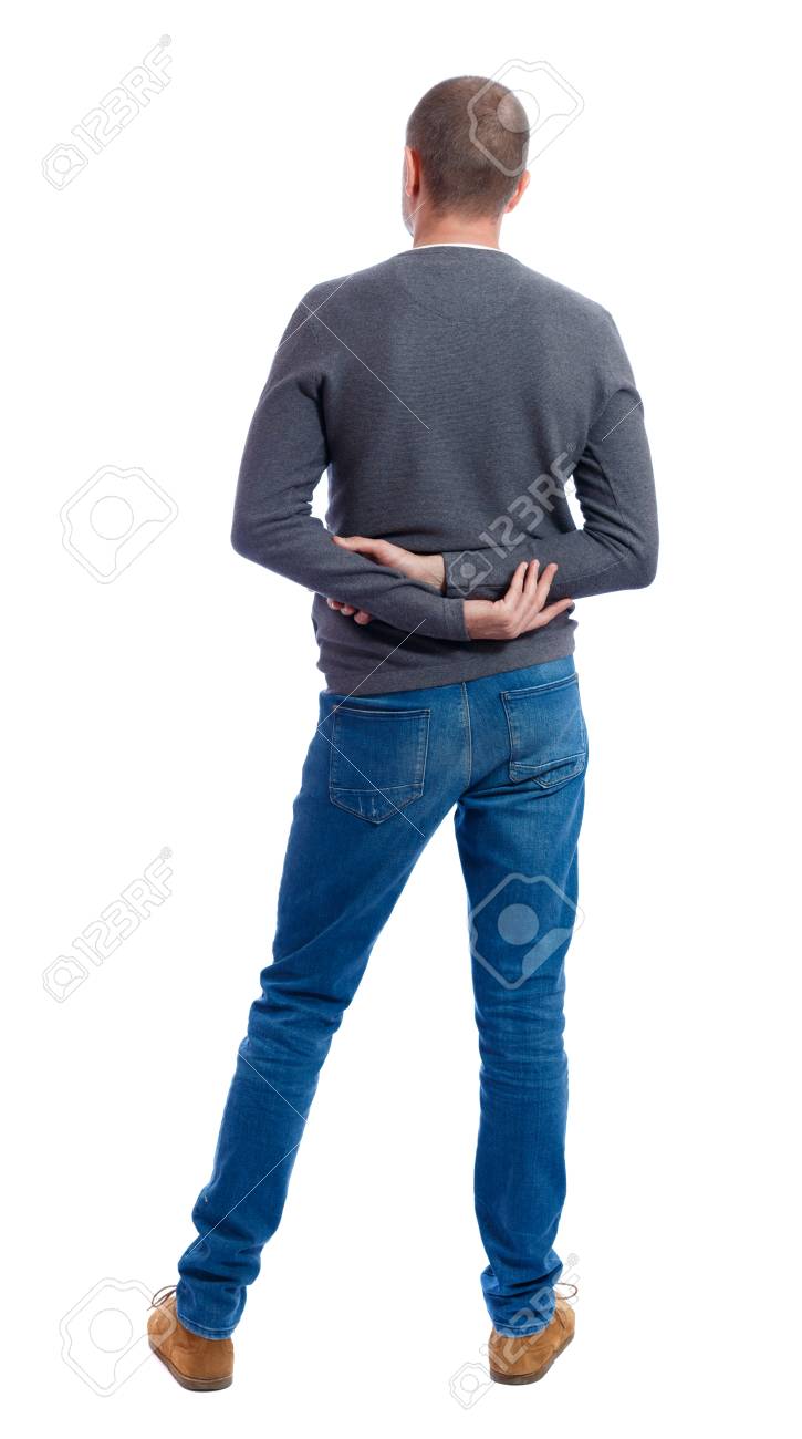ジーンズで男の後ろ姿 若い男が立っています リア人のコレクションを表示します 人の裏面表示 白い背景に分離されました 彼の背中の後ろに両手の灰色のセーター立っている男 の写真素材 画像素材 Image
