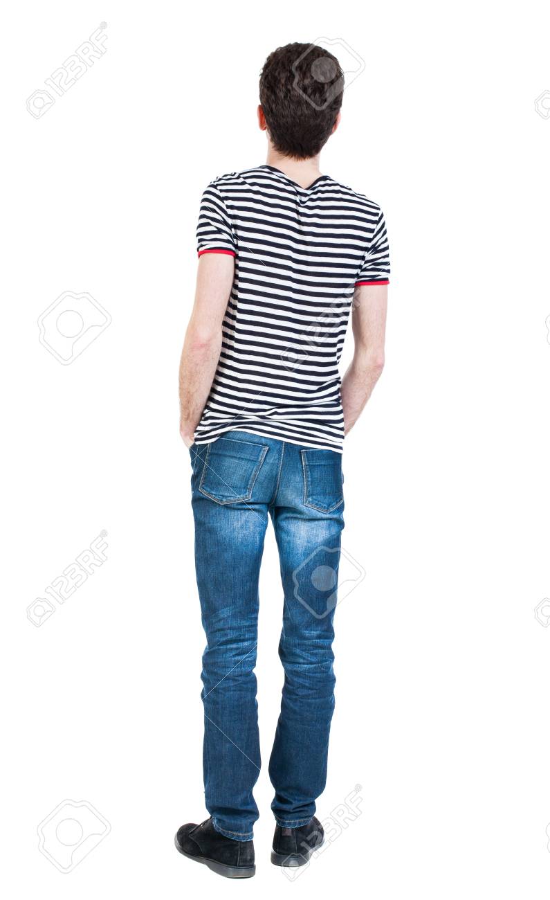ジーンズで男の後ろ姿 若い男が立っています リア人のコレクションを表示します 人の裏面表示 白い背景に分離されました T シャツを着た男は 彼の ジーンズのフロント ポケットに手です の写真素材 画像素材 Image