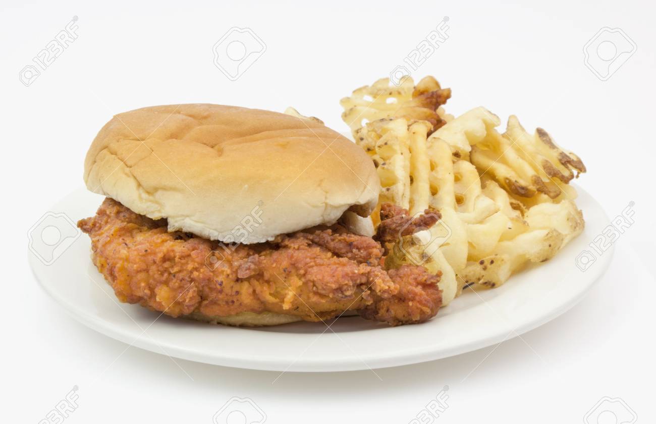 Fried Chicken Sandwich On Plain Bun With Waffle Fries Served Stock Photo Picture And Royalty Free Image Image 80430404