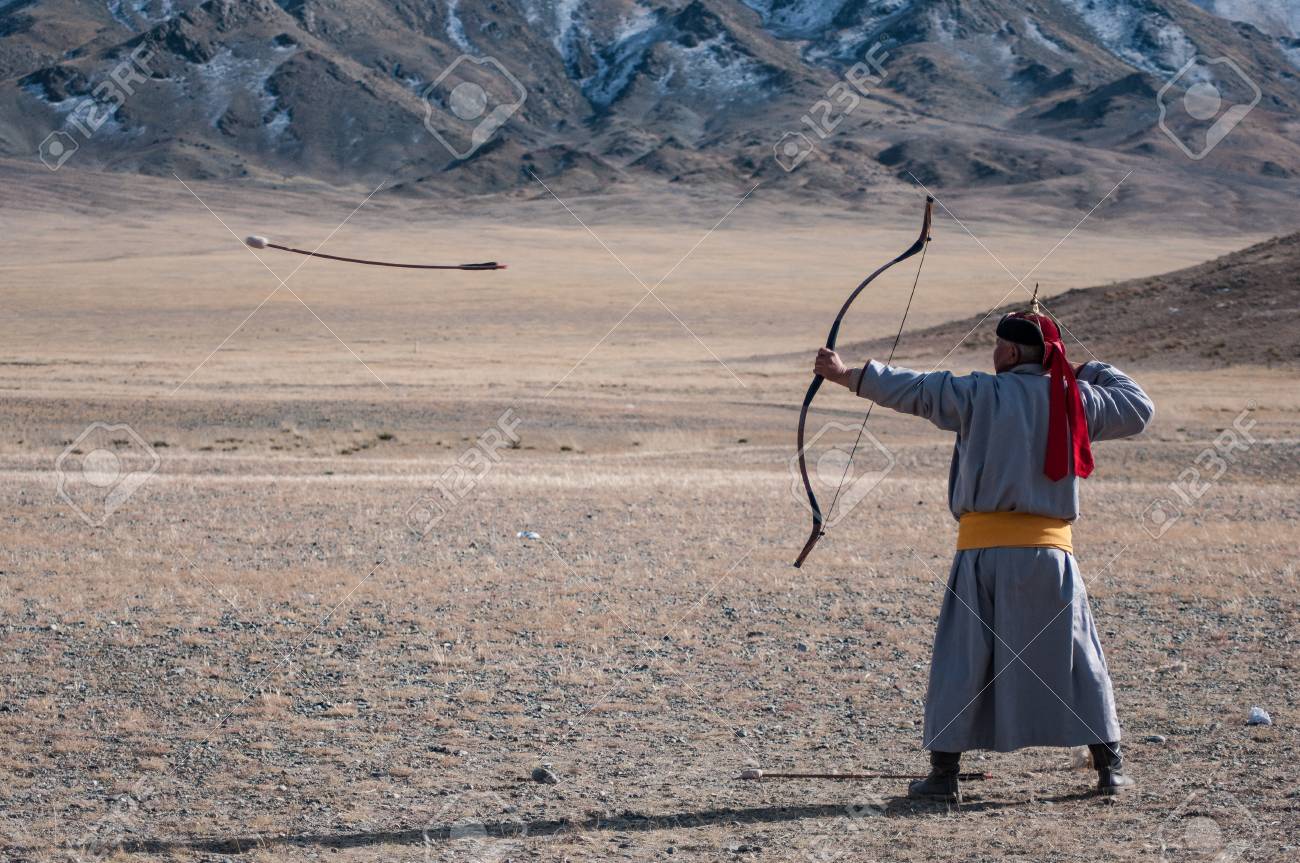 Old Mongolian Man Competing In A N Arrow And Bow Contest During