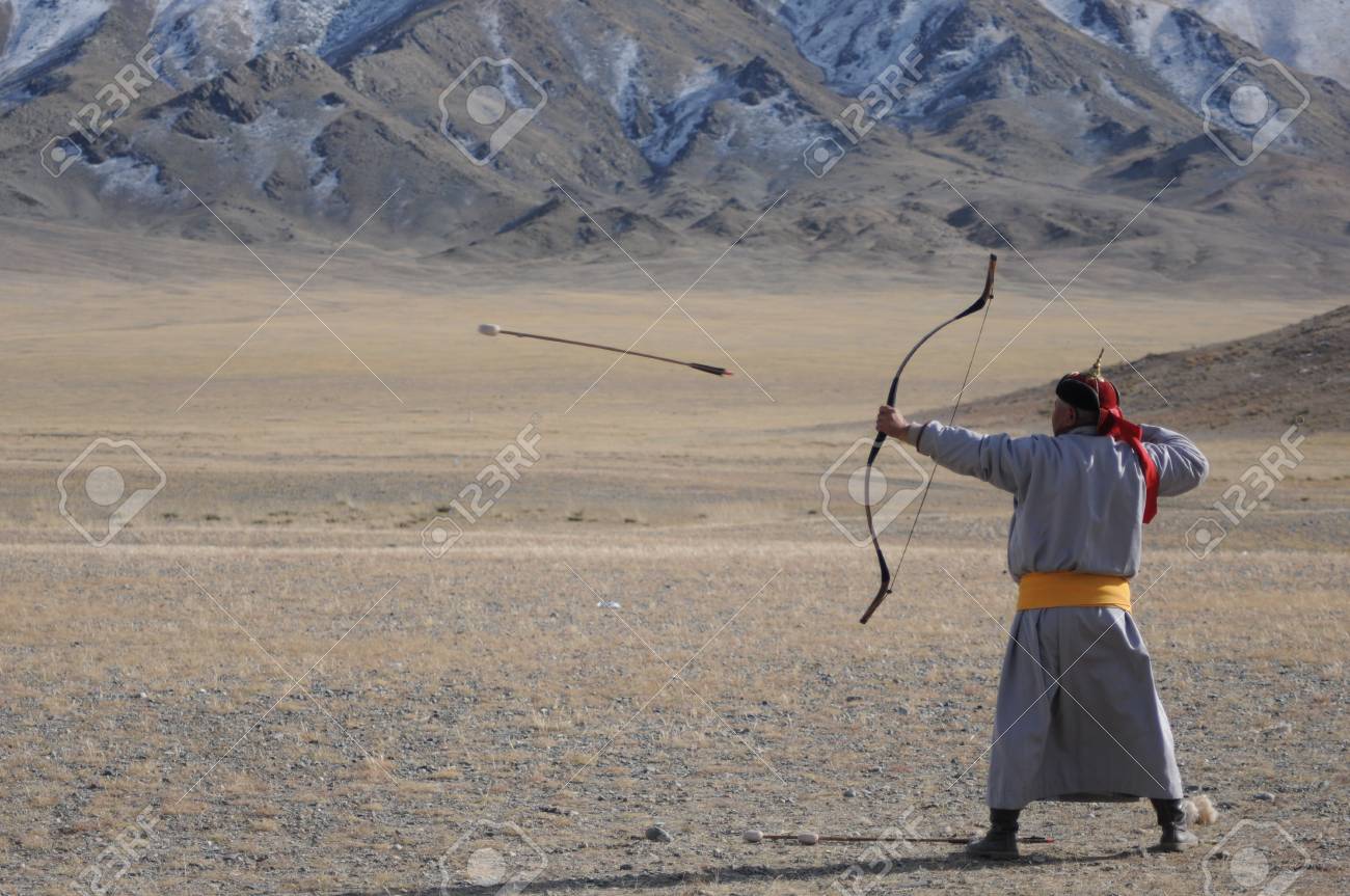 Old Mongolian Man Competing In A N Arrow And Bow Contest During