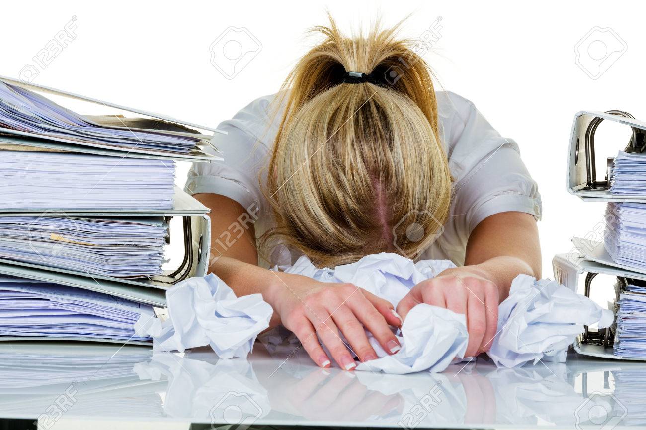 young woman in office is overwhelmed with work burnout in work or study - 26461138 young woman in office is overwhelmed with work burnout in work or study - 26461138