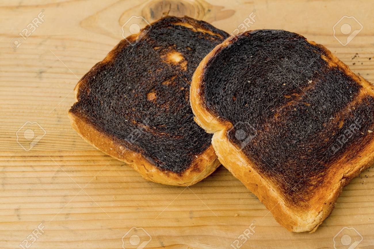 Toasted Bread Was Burned While Toasting. Burnt Slices Of Toast.. Stock  Photo, Picture And Royalty Free Image. Image 89935441.