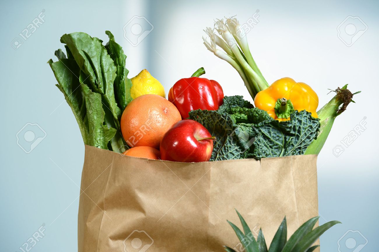 Assortment of fresh produce in grocery paper bag by window - 47647284 Assortment of fresh produce in grocery paper bag by window - 47647284