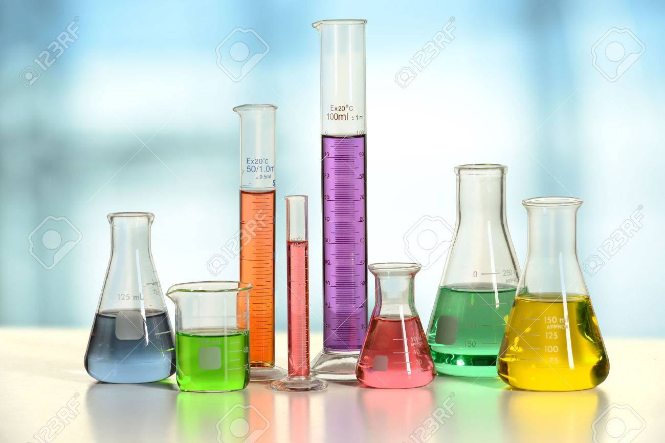 Laboratory glassware with liquids of different colors on white table - With clipping path on glass - 47647302 Laboratory glassware with liquids of different colors on white table - With clipping path on glass - 47647302