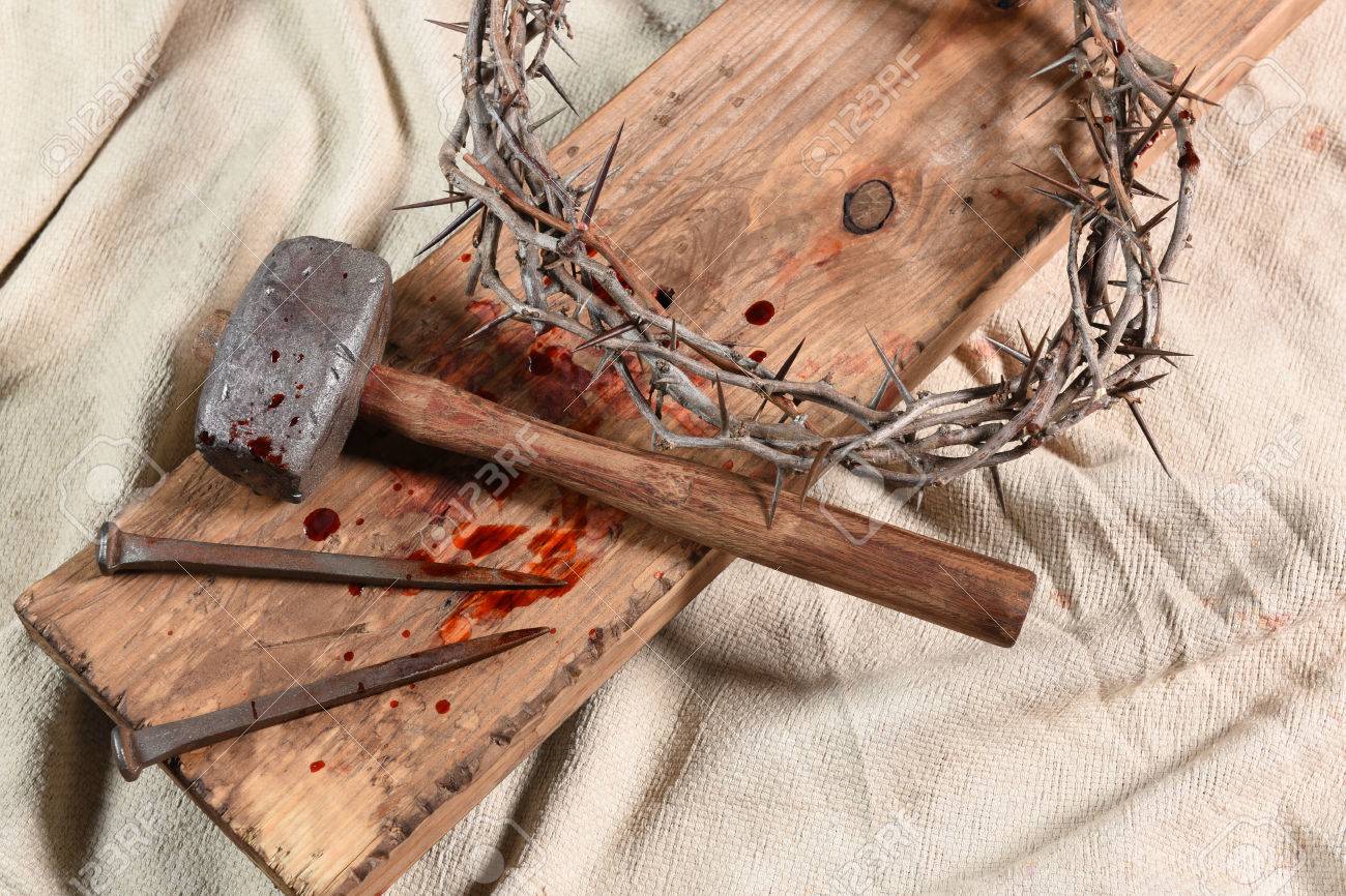 Crown of thorns, nails, and mallet over vintage cloth - 63738418 Crown of thorns, nails, and mallet over vintage cloth - 63738418