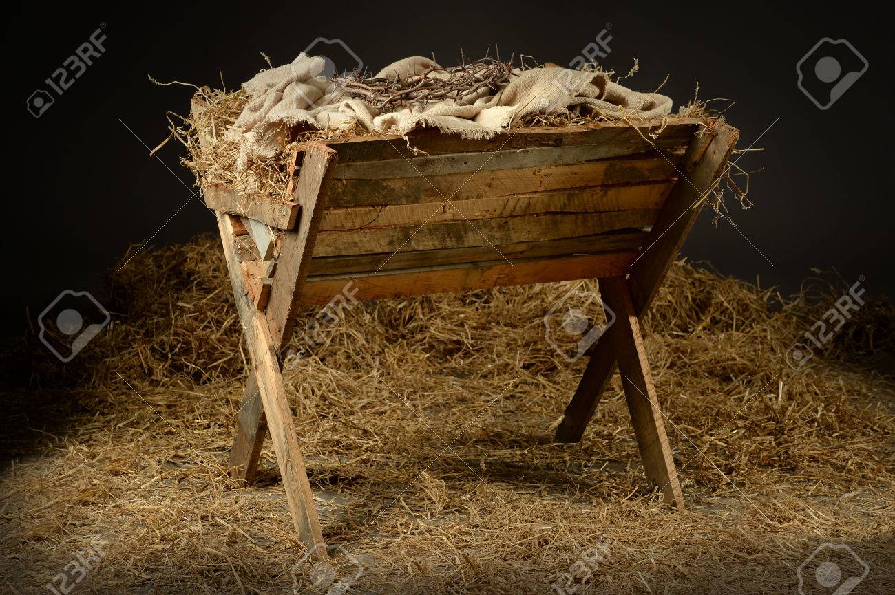 Manger with crown of thorns in barn. Concept based on the birth and death of Jesus. - 63774097 Manger with crown of thorns in barn. Concept based on the birth and death of Jesus. - 63774097