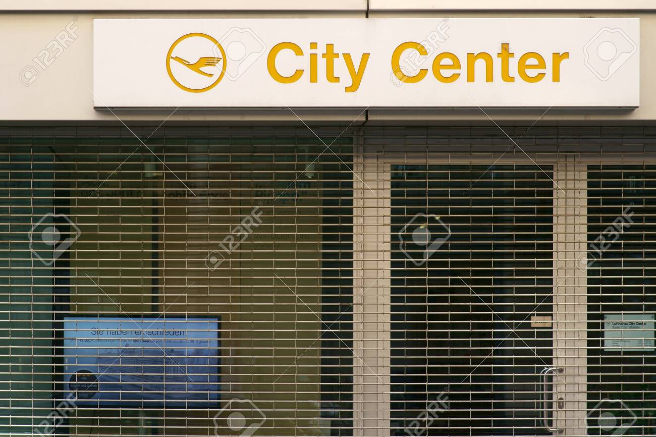 Frankfurt, Germany - July 06, 2019: The logo of the travel agency Lufthansa City Center over the barred shop window of a closed shop on 06 July 2019 in Frankfurt. - 128405407 Frankfurt, Germany - July 06, 2019: The logo of the travel agency Lufthansa City Center over the barred shop window of a closed shop on 06 July 2019 in Frankfurt. - 128405407