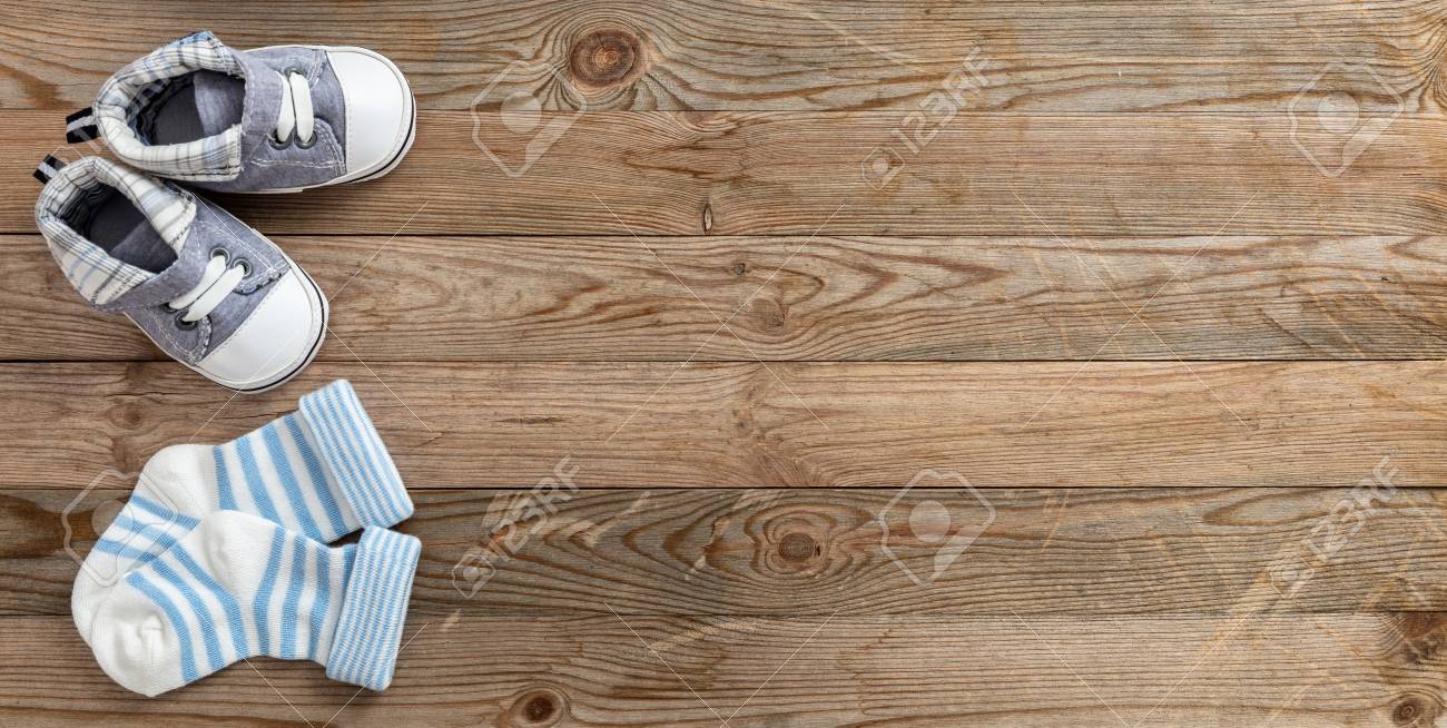 Baby boy shower concept on wooden background, copy space, top view - 107531133 Baby boy shower concept on wooden background, copy space, top view - 107531133