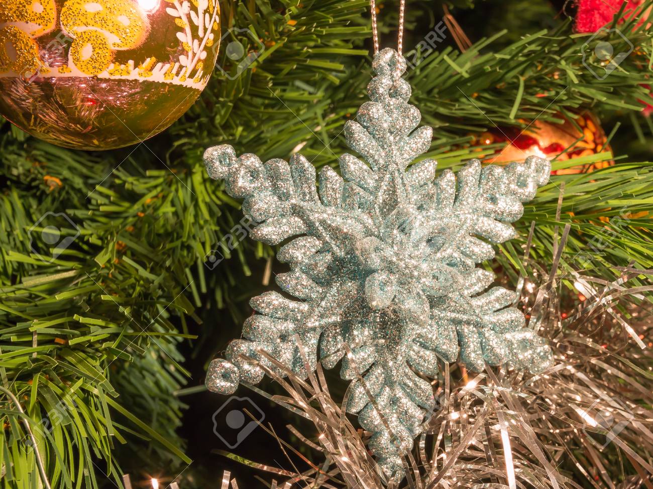 Bright Silver Six Point Star Decoration On Green Christmas Tree Stock Photo Bright Silver Six Point Star Decoration On Green Christmas Tree Stock Photo