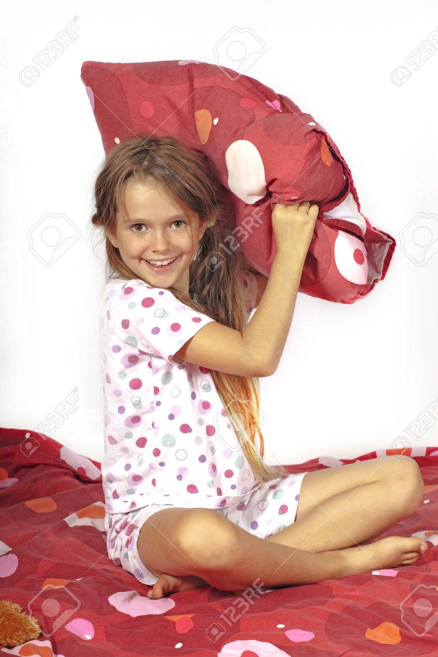 Eight Year Old Girl In Bed Doing A Pillow Fight Stock Photo Picture And Royalty Free Image Image