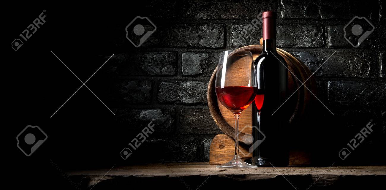 Red wine on a background of old black bricks - 52587528 Red wine on a background of old black bricks - 52587528