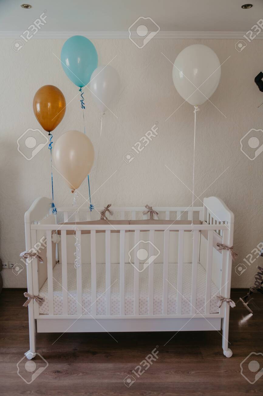 white wooden cot