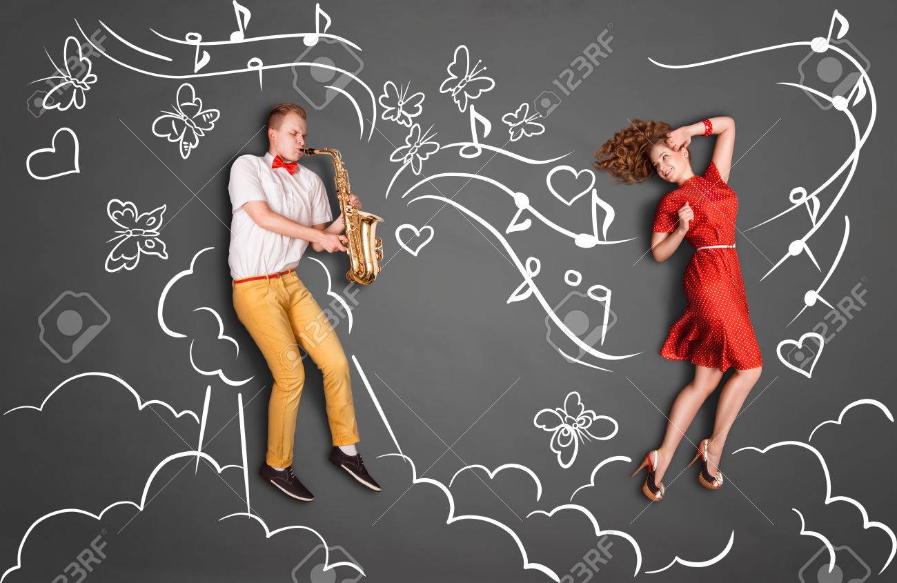 Love Story Concept Of A Romantic Couple Against Chalk Drawings Heaven  Background. Male Playing The Sax For His Girlfriend. Stock Photo, Picture  and Royalty Free Image. Image 41249264.