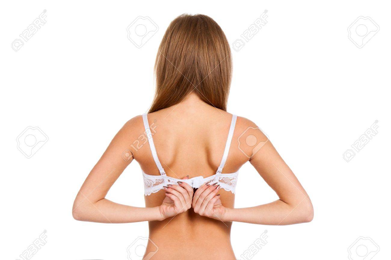 Rear View Of A Young Woman Taking Off Her Bra Stock Photo, Picture and  Royalty Free Image. Image 12586211.