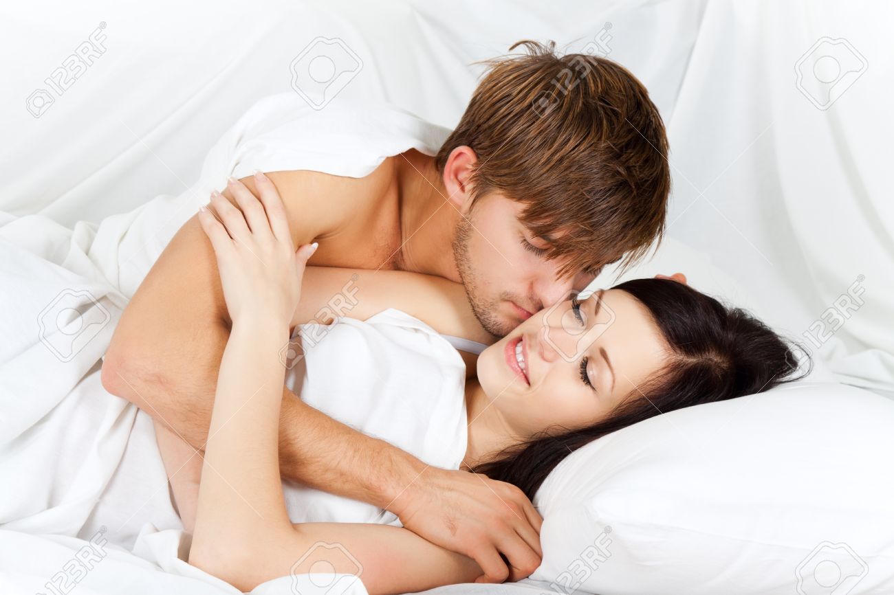 Young Lovely Couple Lying In A Bed Happy Smile