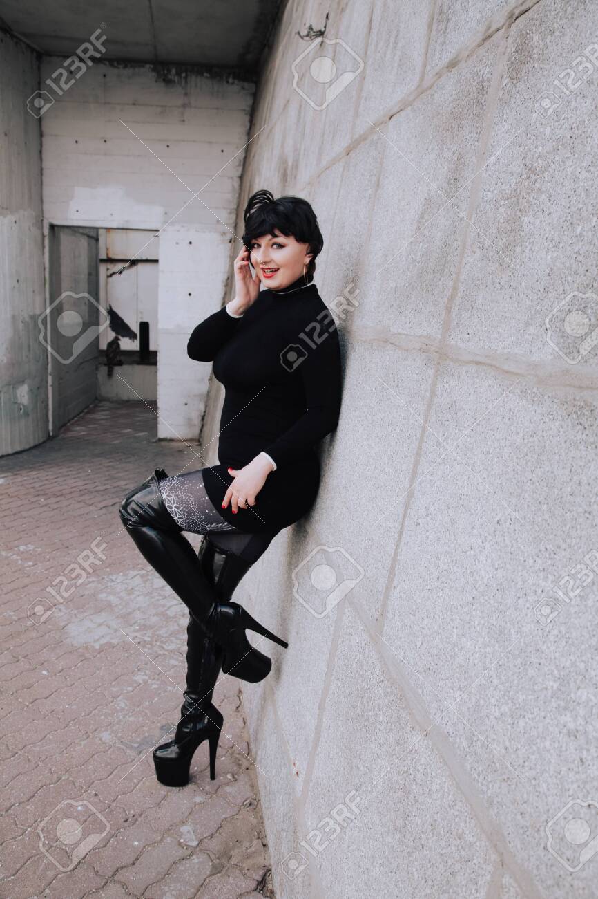 Plus Size Short Hair Brunette Woman In Knitted Sweater Dress