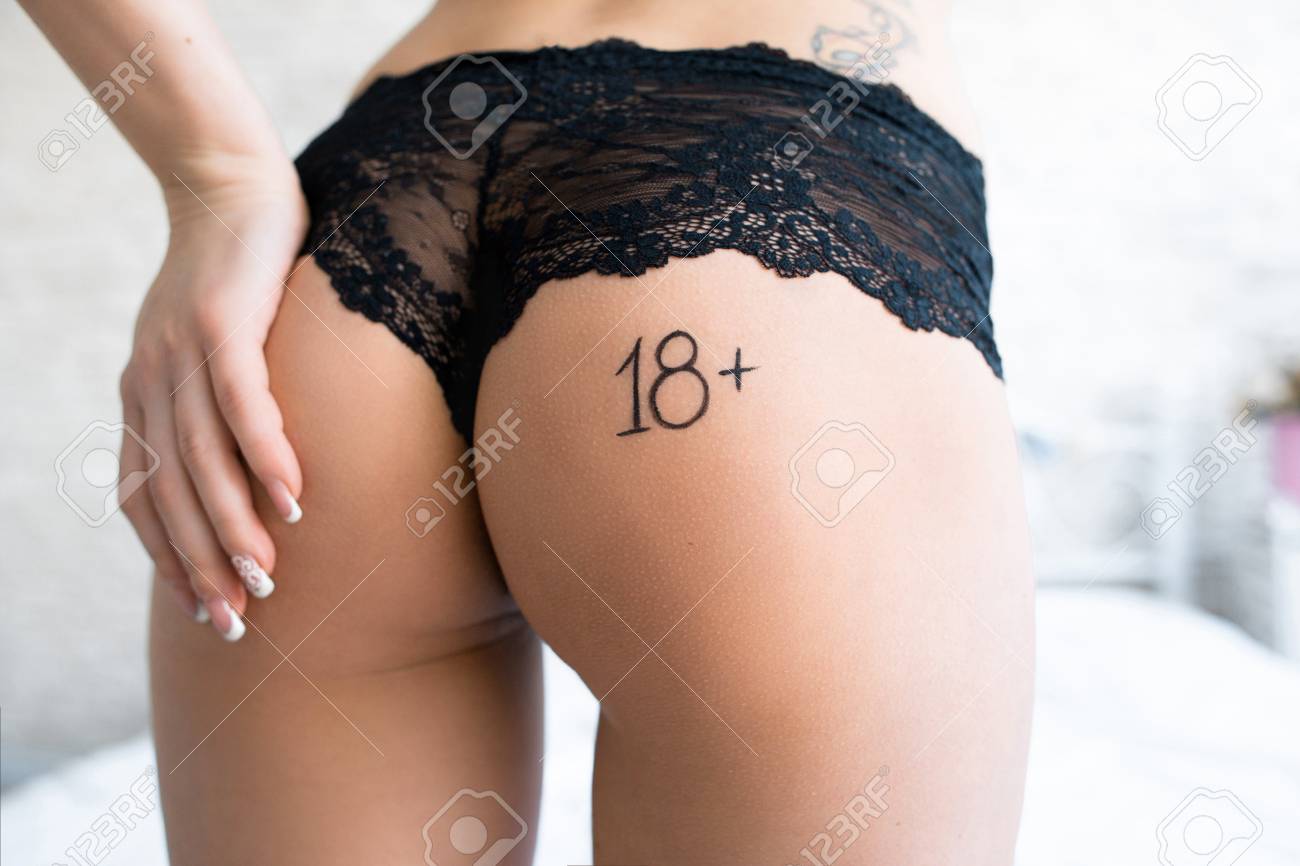 Seductively Touching Ass Women With Remark 18plus. Sexy Buttocks In Black  Panties With Text 18plus On It. Unrecognizable Sexy Woman Caressing Her Ass  Closeup Stock Photo, Picture and Royalty Free Image. Image