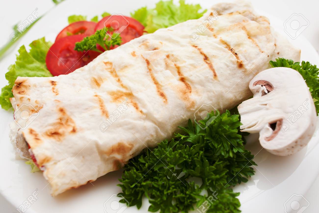 burrito with fresh mushroom and parsley close up grilled shawarma