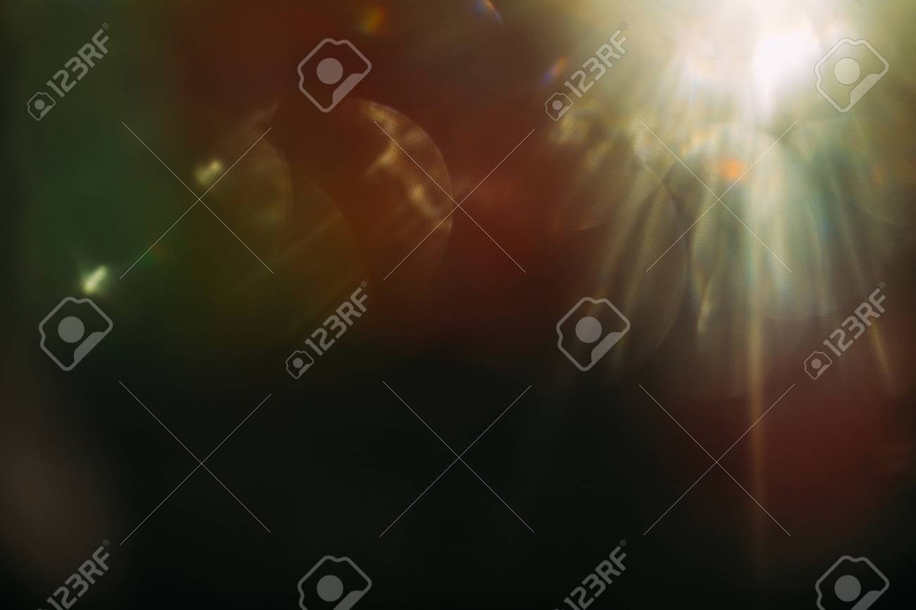 lens flare. colorful abstract. bokeh light on black background. ray leak - 100153273 lens flare. colorful abstract. bokeh light on black background. ray leak - 100153273