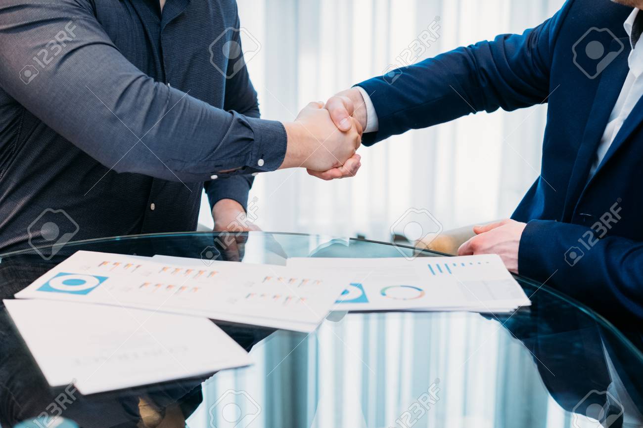 closing or sealing a deal. business partners shaking hands. cooperation partnership, trust joint venture concept - 100754077 closing or sealing a deal. business partners shaking hands. cooperation partnership, trust joint venture concept - 100754077