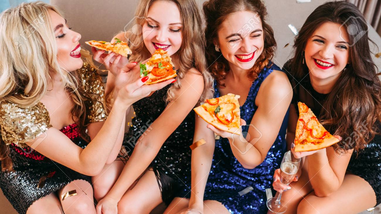Girls Party. Best Friends Hanging Out, Having Fun, Laughing. Young Ladies  Feeding Each Other With Delicious Pizza. Stock Photo, Picture and Royalty  Free Image. Image 121425970.