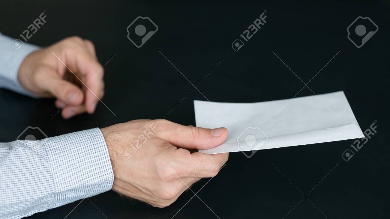 mail delivery service cropped shot of man passing envelope with letter delivery