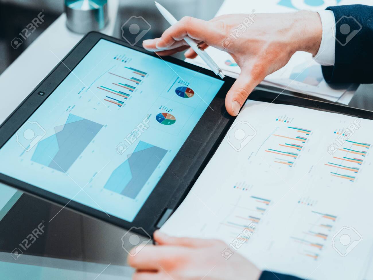 Business marketing study. CEO reviewing statistics report on laptop - 128680278 Business marketing study. CEO reviewing statistics report on laptop - 128680278
