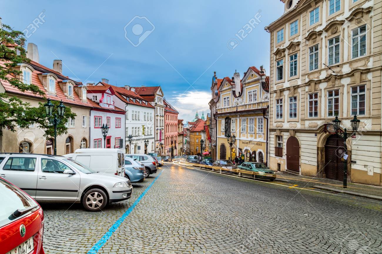 PRAGUE, CZECH REPUBLIC - AUGUST 26, 2014: Locals And Tourists Walk And Cars  Move In Street In The Historical Center Of Prague Stock Photo, Picture and  Royalty Free Image. Image 98058984.