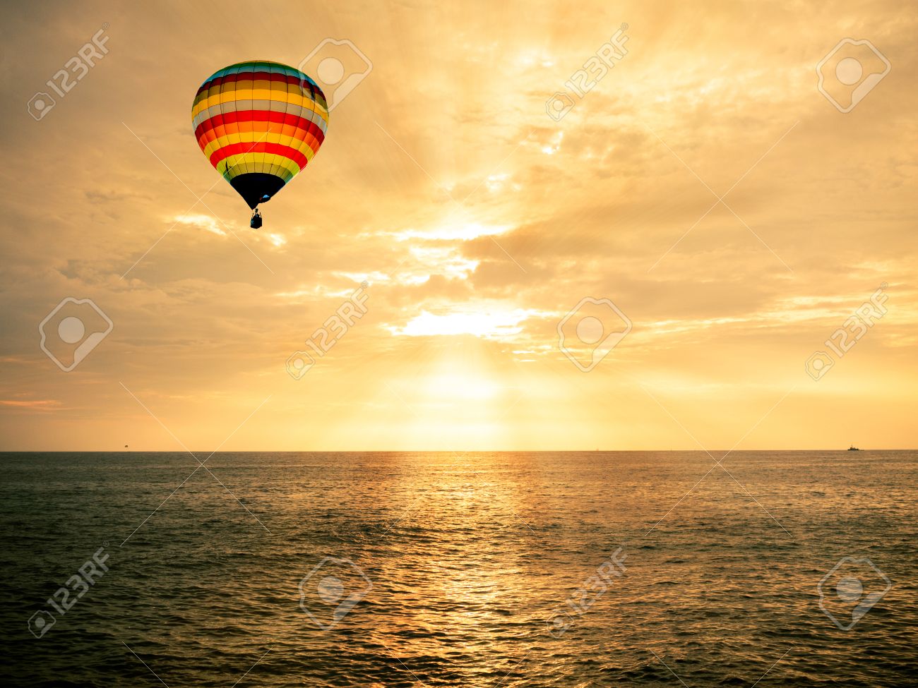 Hot air balloon over the sea at sunset - 32757849 Hot air balloon over the sea at sunset - 32757849
