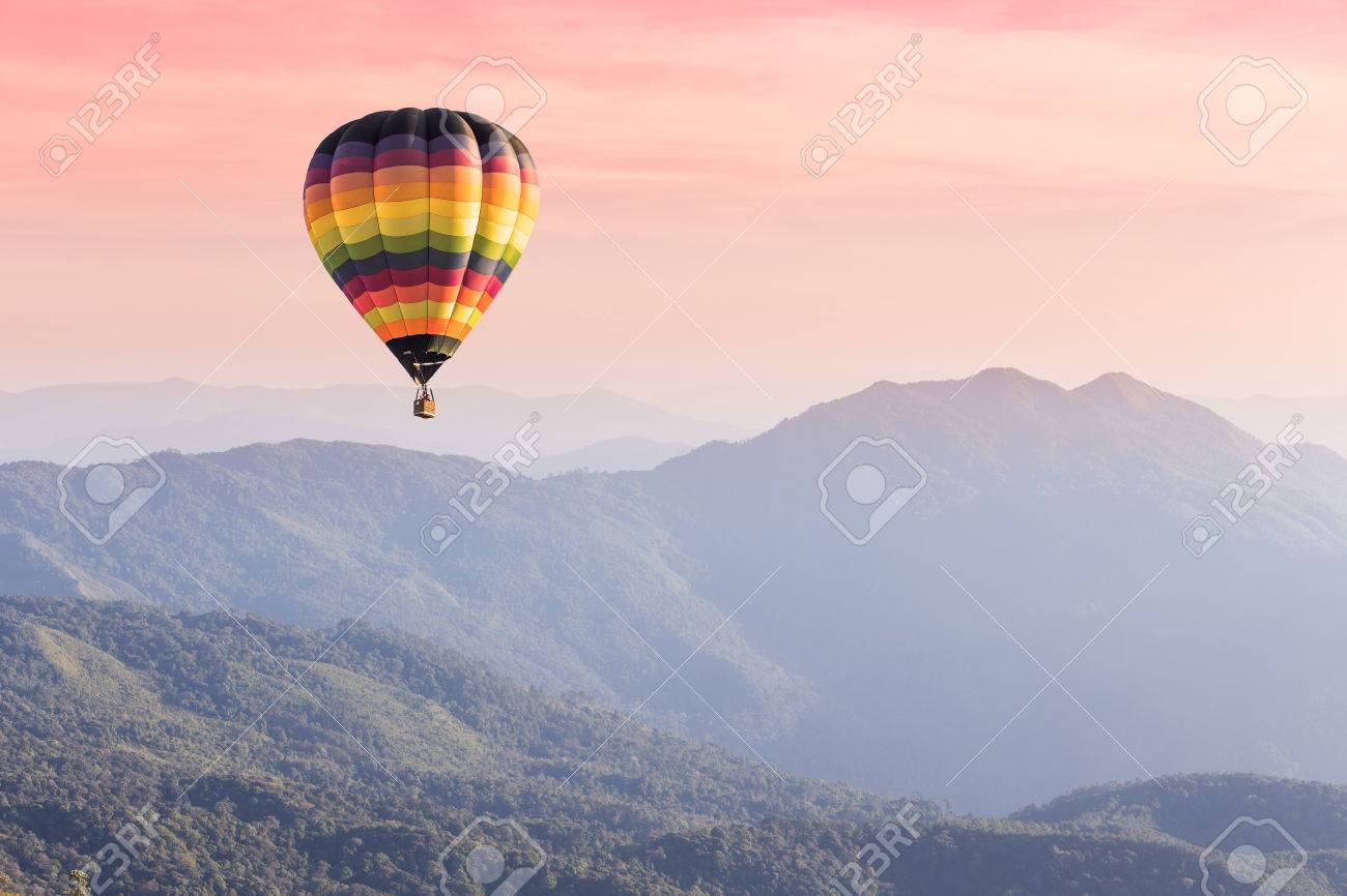 Hot air balloon above high mountain at sunset - 50844952 Hot air balloon above high mountain at sunset - 50844952