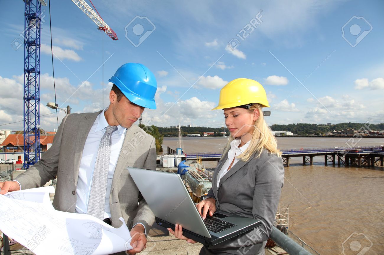 architect and supervisor checking site under construction stock architect and supervisor checking site under construction stock