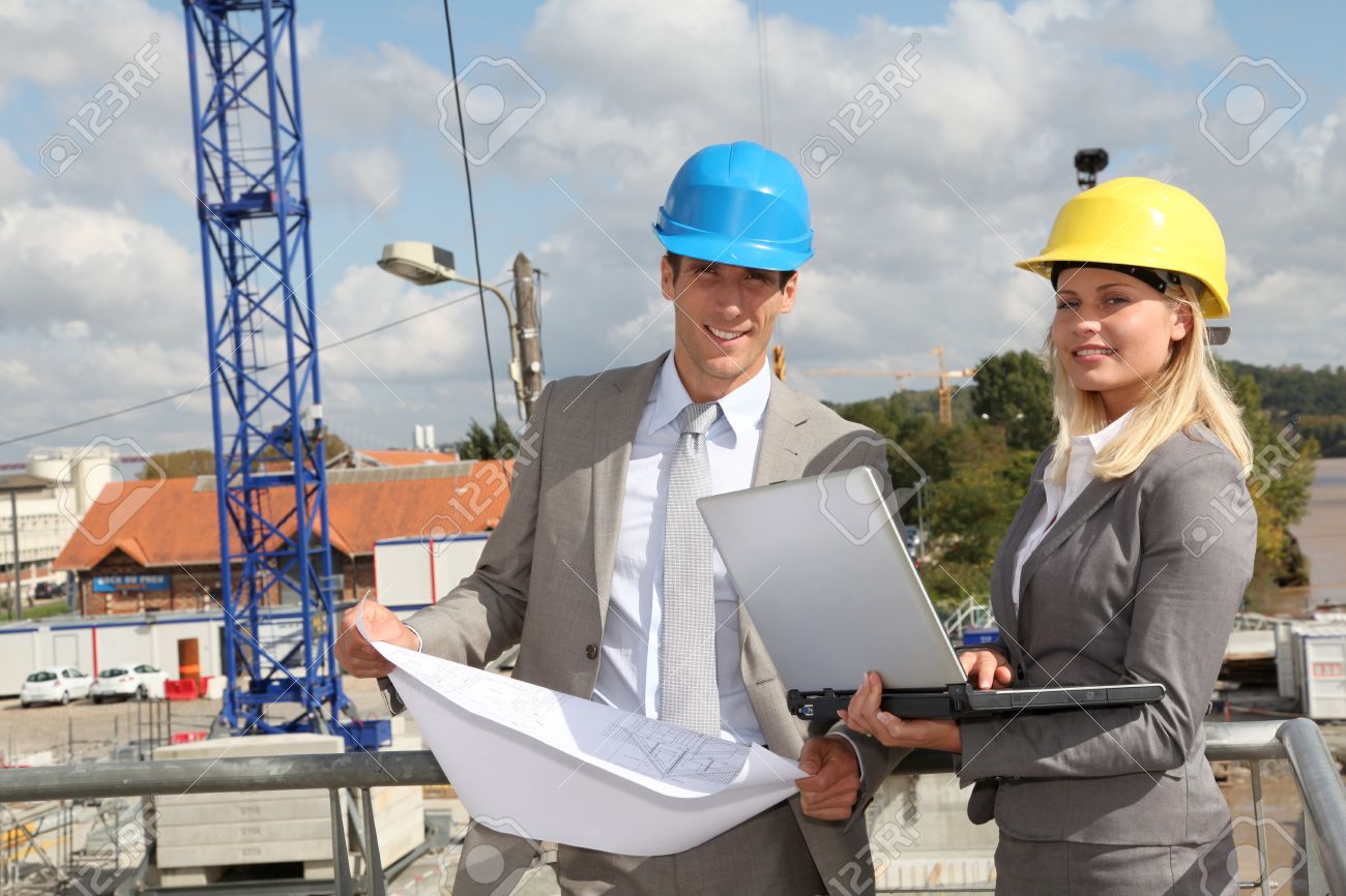 architect and supervisor checking site under construction stock architect and supervisor checking site under construction stock
