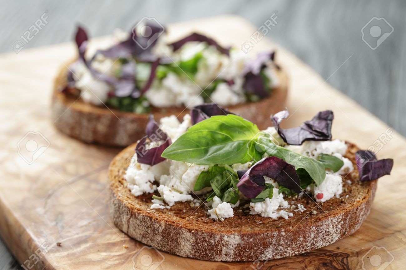 rye sandwich or bruschetta with ricotta, herbs and basil - 40936014 rye sandwich or bruschetta with ricotta, herbs and basil - 40936014