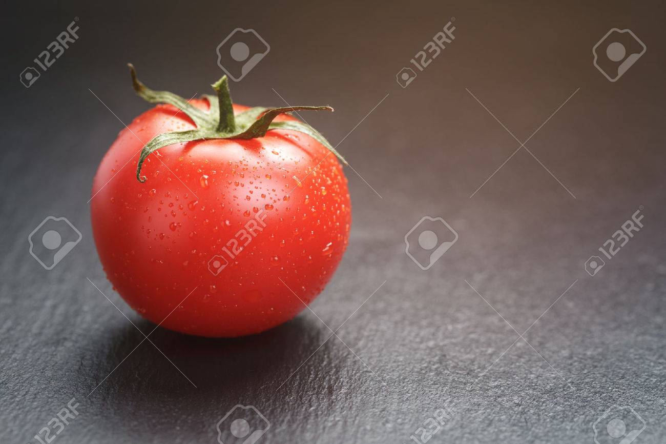 ripe tomato on slate board, vintage toned - 44909634 ripe tomato on slate board, vintage toned - 44909634