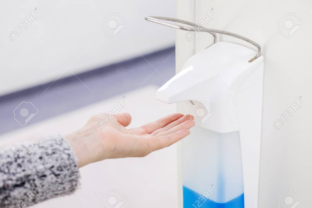 Hands disinfection dispenser in medical center. Antibacterial procedure - 98799920 Hands disinfection dispenser in medical center. Antibacterial procedure - 98799920