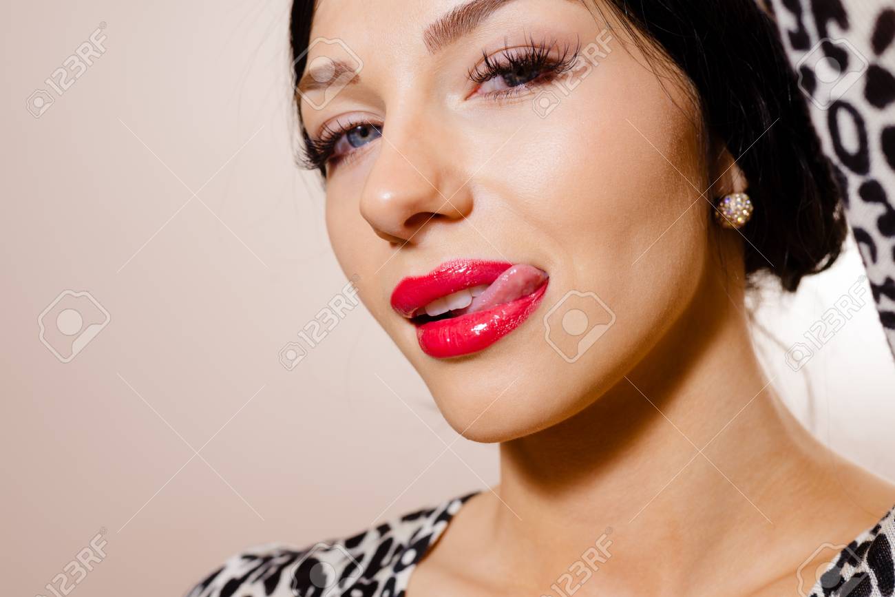 Portrait Of Beautiful Young Lady In Animal Print Top Licking Her Lips Sexy Girl With Portrait Of Beautiful Young Lady In Animal Print Top Licking Her Lips Sexy Girl With