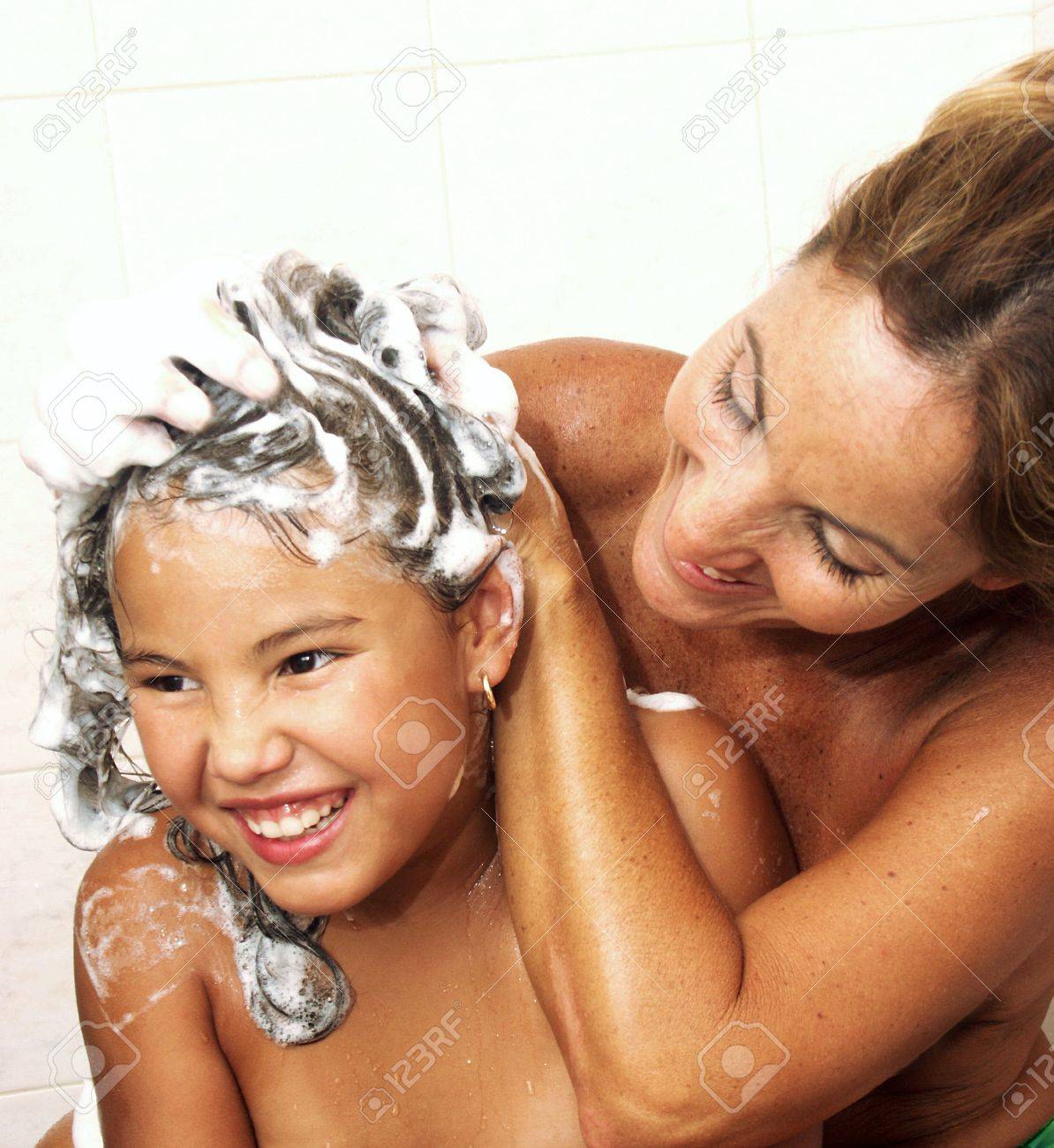 Mother And Daughter Showering In The Bathroom Stock Photo, Picture and  Royalty Free Image. Image 22413339.
