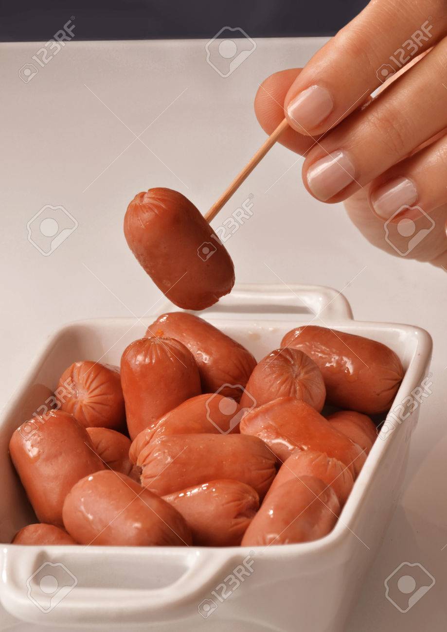 Picking Mini Sausages Salamis With 